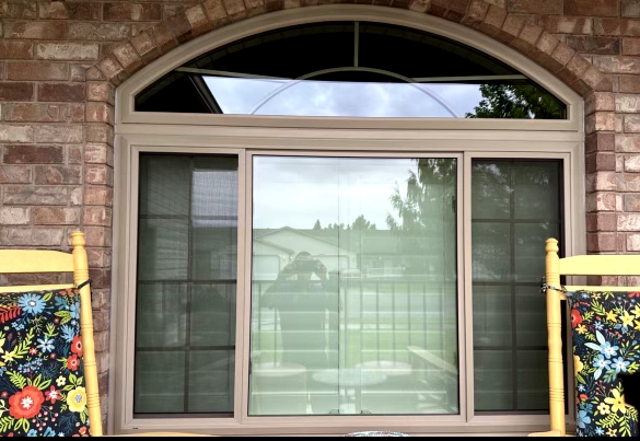 Window with decorative chairs outside