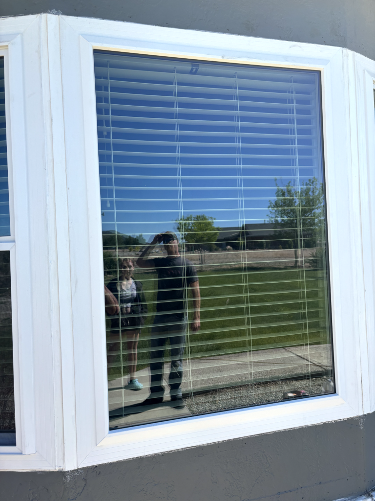 Reflection of people in window
