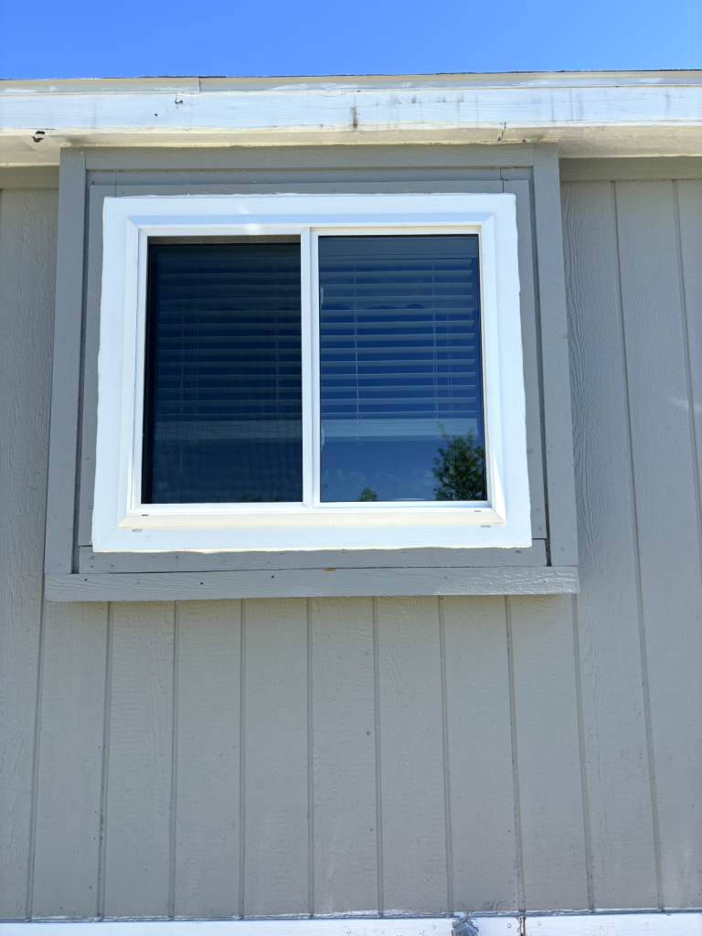 White window on gray wall