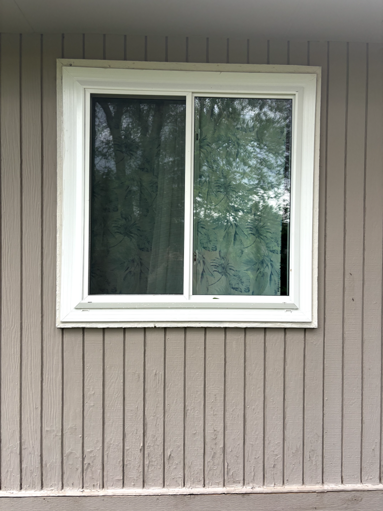 Window with patterned curtains outdoors