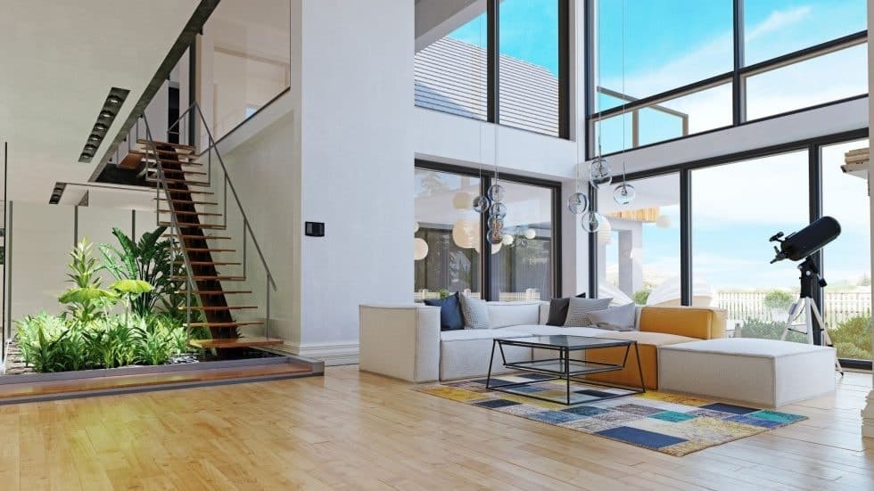 Bright modern living room with large windows and telescope, overlooking scenic view.