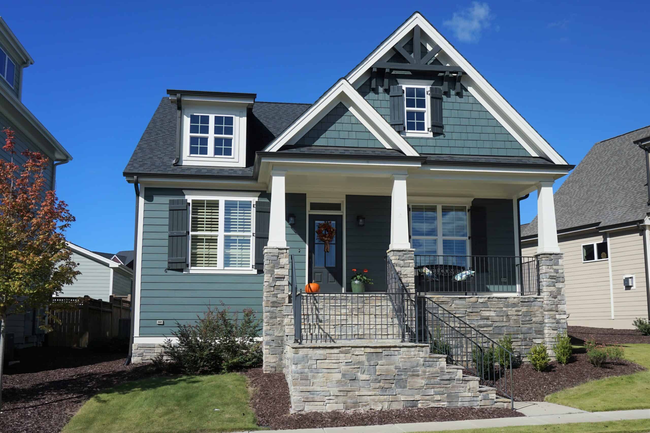Blue house with new windows and siding.